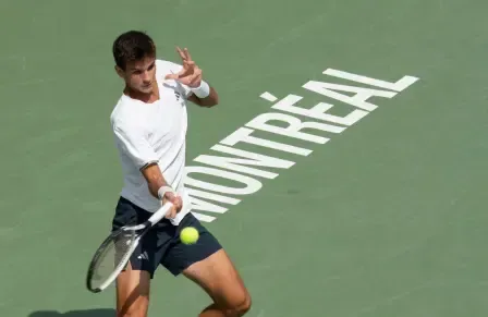 Rafael Jodar of Spain hits a return to Arthur Fils of France during quarterfinal tennis action at the National Bank Open in Montreal on Tuesday, Aug. 11, 2026. (Christinne Muschi /The Canadian Press via AP)